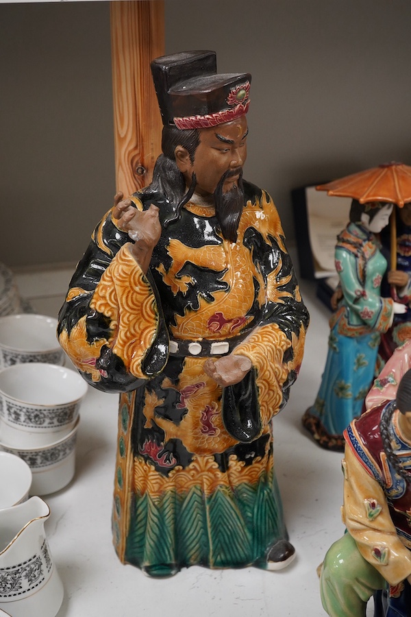 Four Chinese glazed earthenware figure groups, largest 42cm high. Condition - fair to good